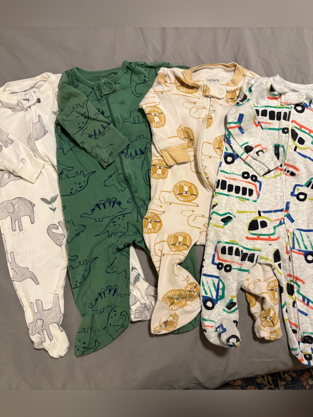 Carter's 6M Footed Pajama Bundle of 4 - Elephant, Dinos, Lions, Transportation
